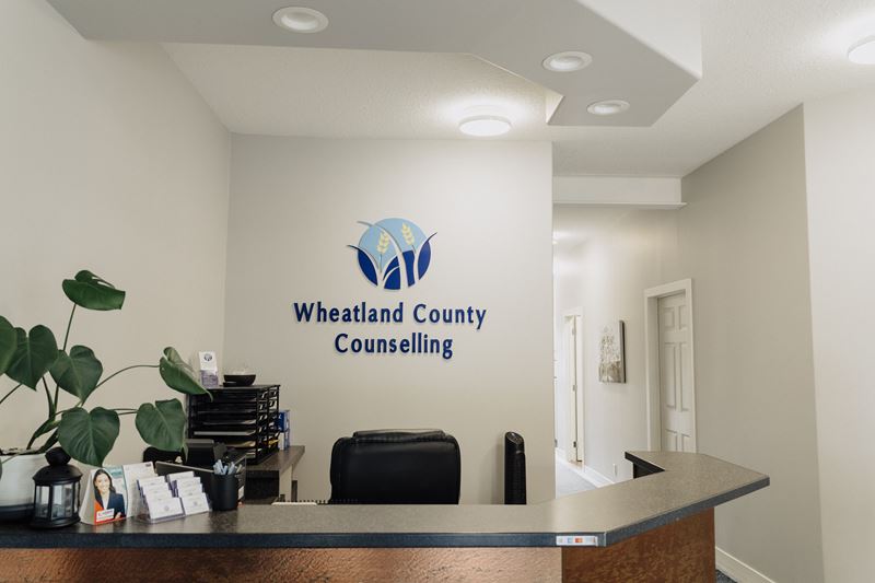A reception area with a sign for wheatland county counseling.